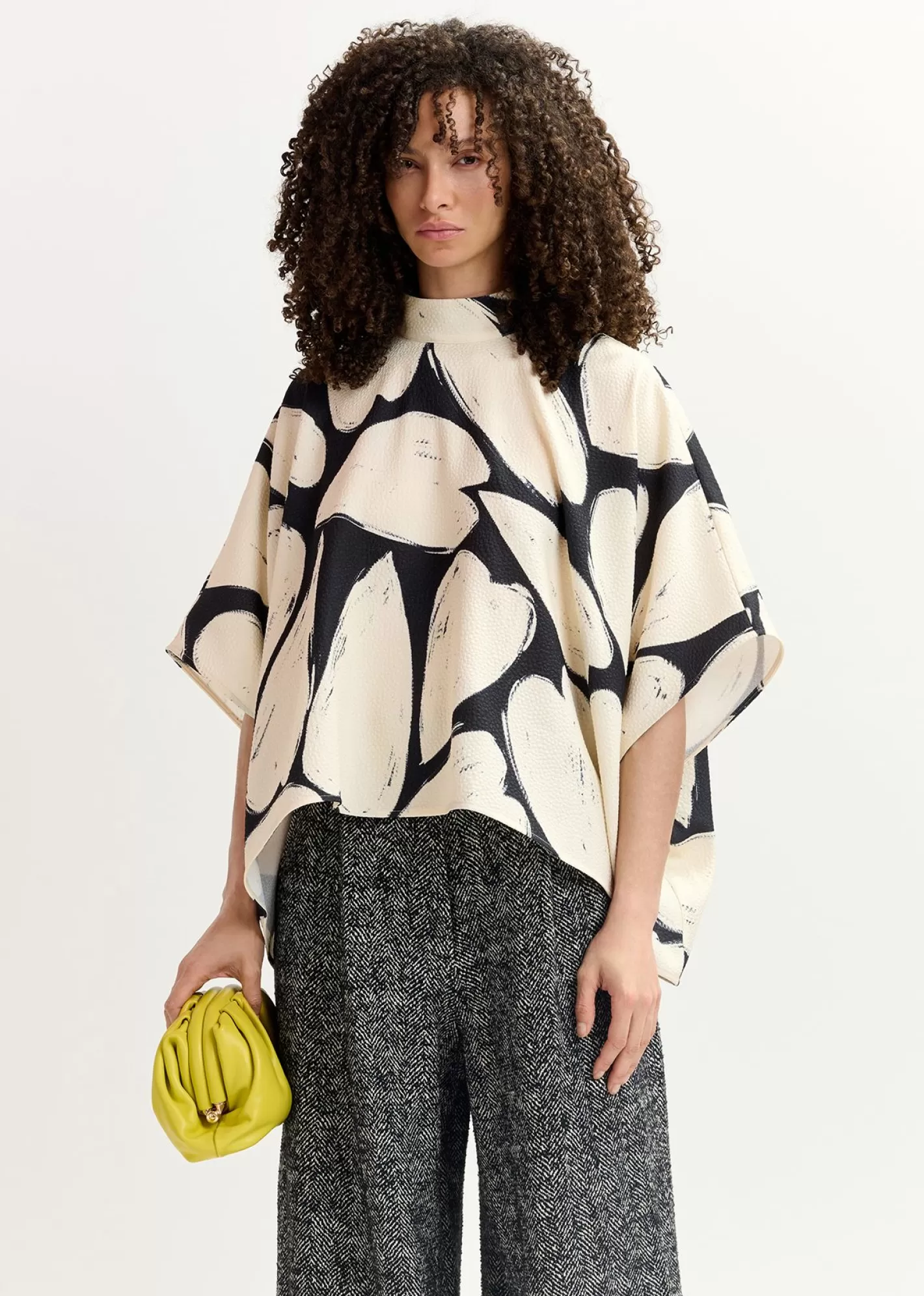 Hot Black and off-white oversized top with stand-up collar Fall 2024 Collection | Prints