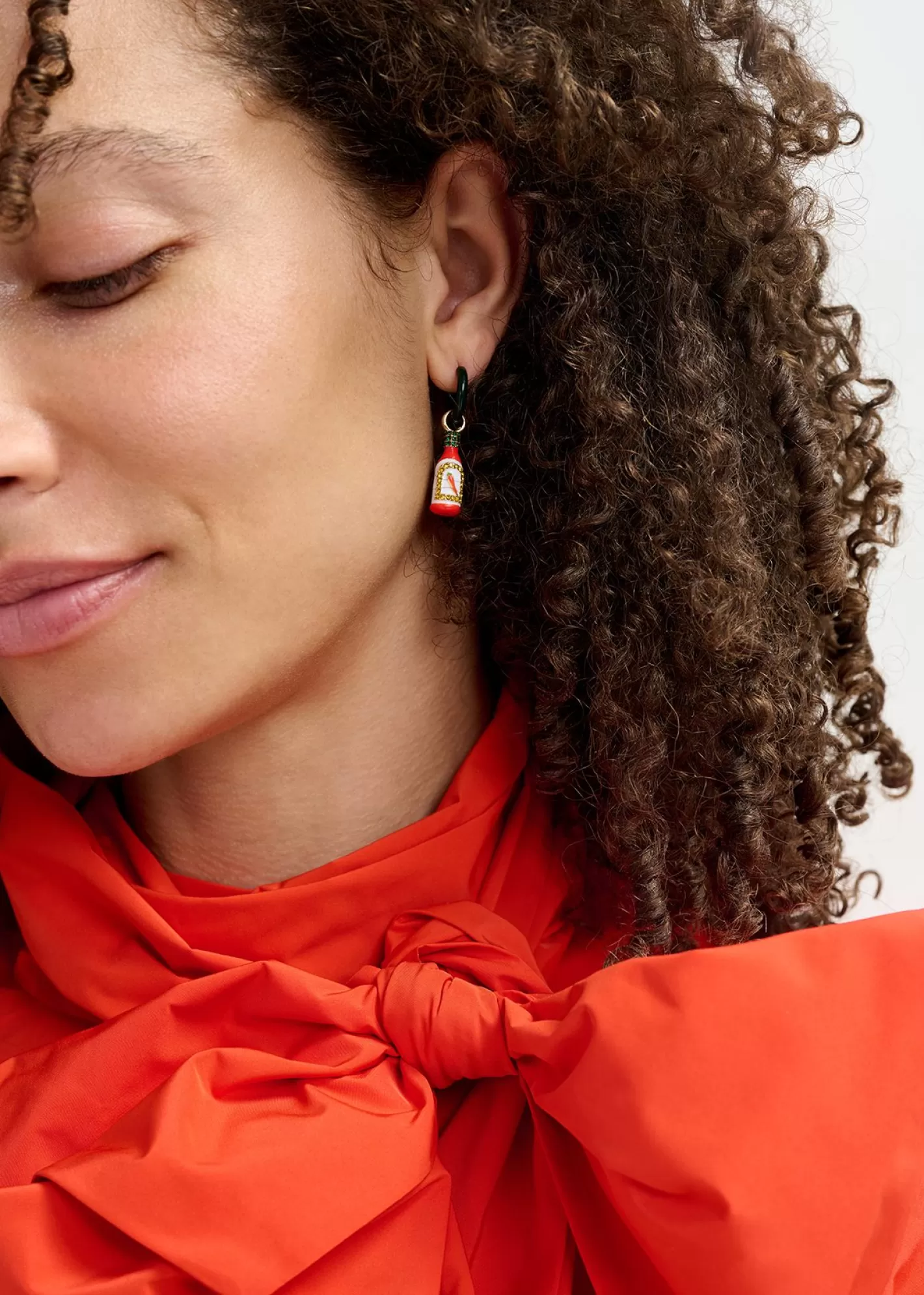 New Black hoop earrings with crocodile and hot sauce pendants Fall 2024 Collection | Jewelry