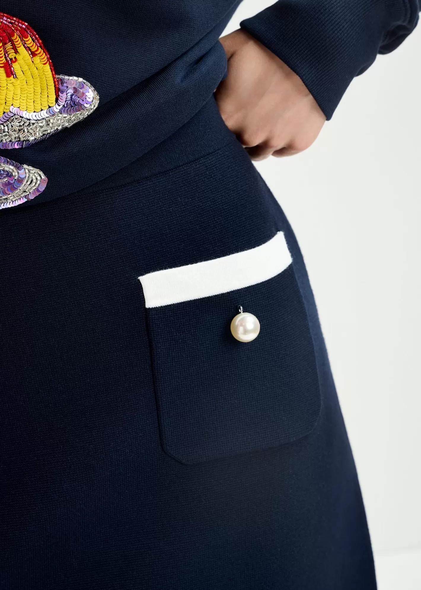 Shop Dark blue knitted skirt with contrasting trims and pearl buttons Skirts