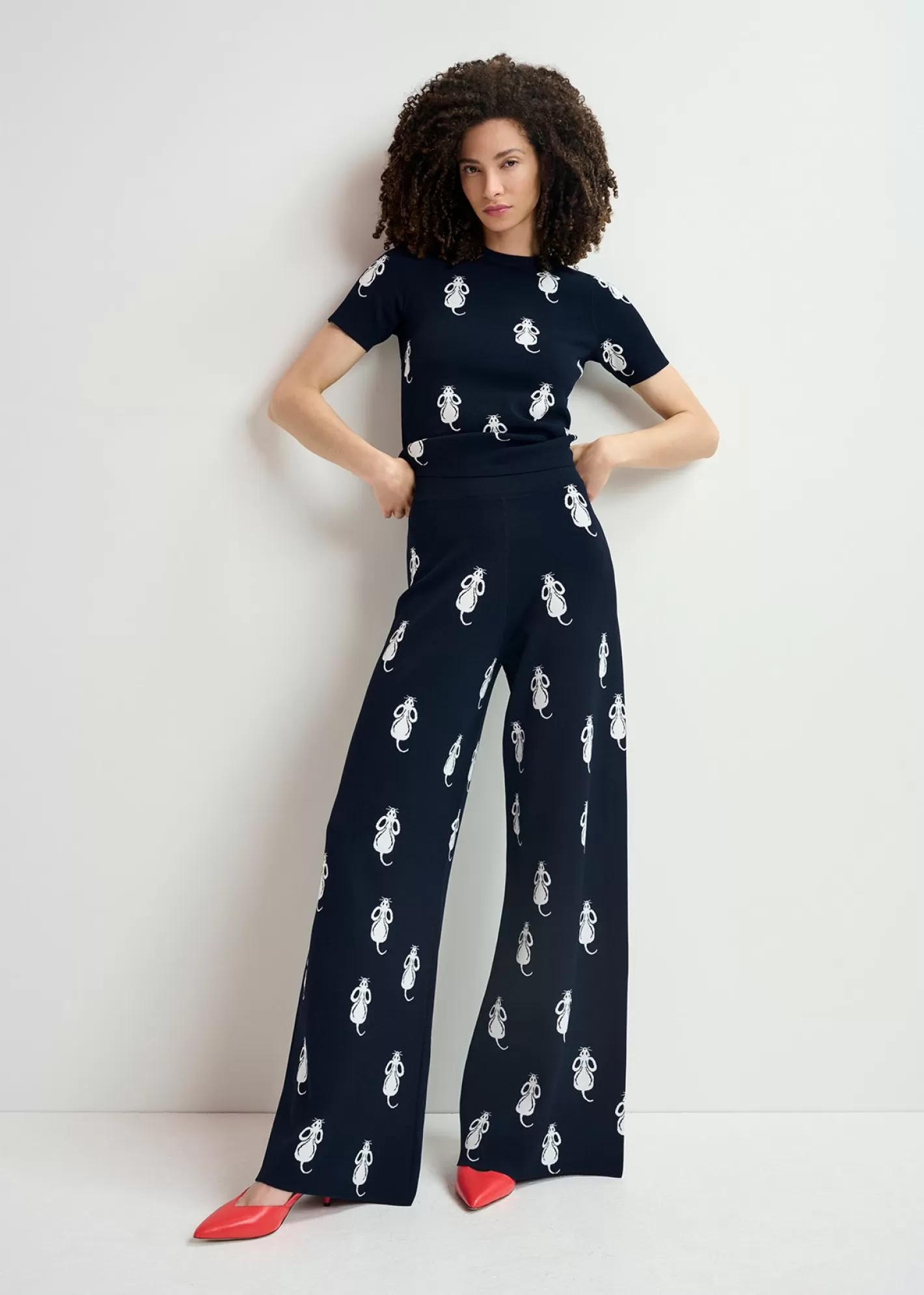 Shop Navy blue flared knitted pants with mice pattern Prints | Pants & Shorts